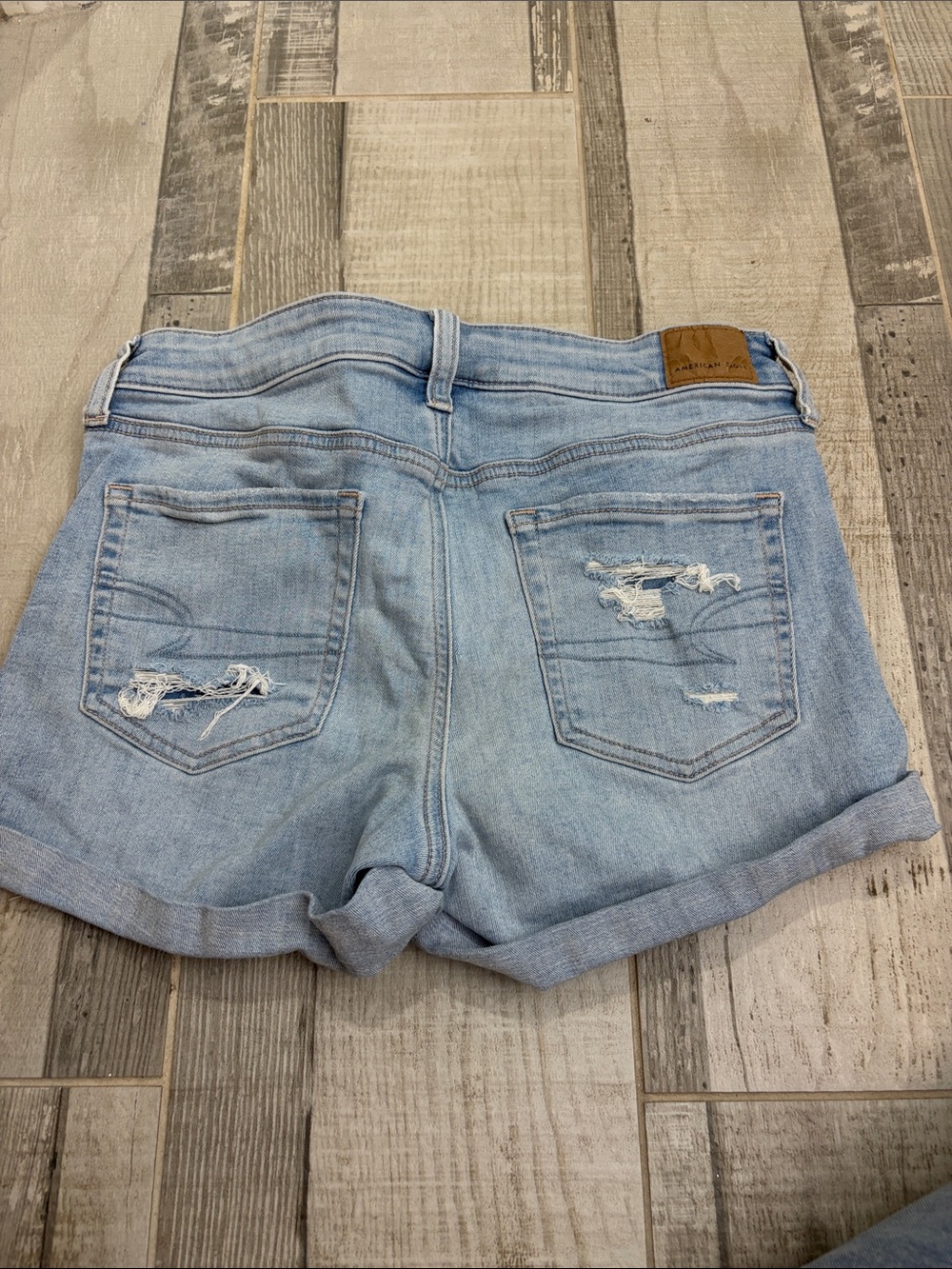 Light washed American eagle fake rip jean shorts